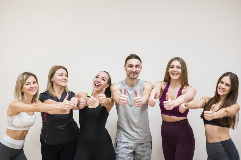 A group of slim and good-looking people rejoicing